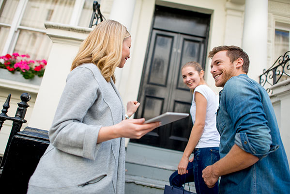 Couple Looking At House